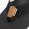 Black herringbone-shaped slippers, brown leather decoration, white brand label, black wavy rubber sole Application Scenario
